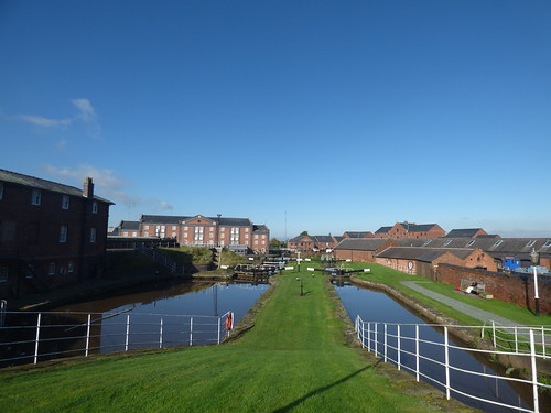 A photo titled "Shropshire Shropshire Union Canal from The National Waterways Museum, Ellesmere Port -  Whitby No 2 Narrow and Wide LocksCanal from The National Waterways Museum, Ellesmere Port - Whitby Top Narrow and Wide Locks", taken near Sluice by ell brown on Flickr.