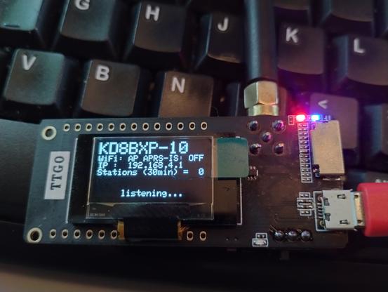 TTGO LoRa board with oled screen, setup as an digipeater for LoRa APRS, on the screen shows KD8BXP-10 and listening as well as some other information.