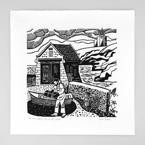A single colour linocut print of the old lifeboat station at Lizard, Cornwall. It shows a fisherman carrying a lobster pot in front of a small boat which is in front of the old lifeboat station.
