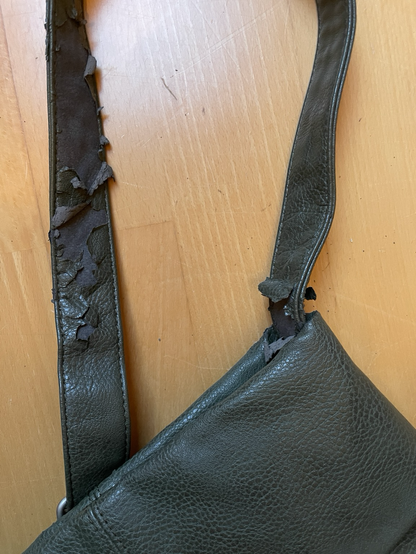 Broken fabric surface on handbag strap