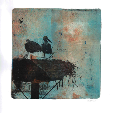 Gel plate print of two storks standing on a nest on a pole, positioned in the bottom left corner, printed as a black silhouette against a blue and reddish brown background. The stork on the right seems to be looking at something to the right. I like the colors in this one, though a bit muted and dark.