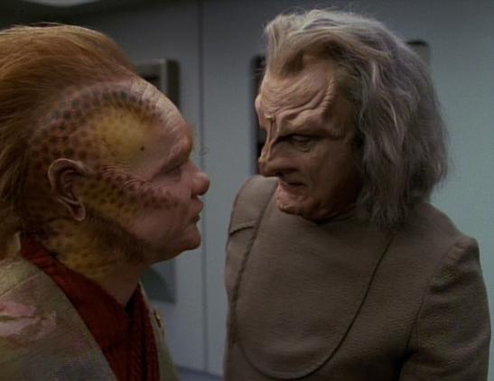 Neelix speaks to Jetrel, a Haakonian scientist who created the matreon cascade, a devasting weapon of mass destruction that ended the Haakonian Talaxian war and destroyed Neelix's family.