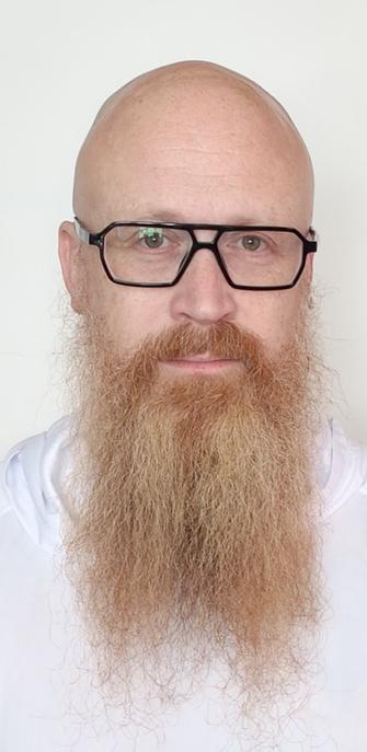 Me. Wearing black glasses. I'm bald. My once finger beard is very faded and almost white over a large part.