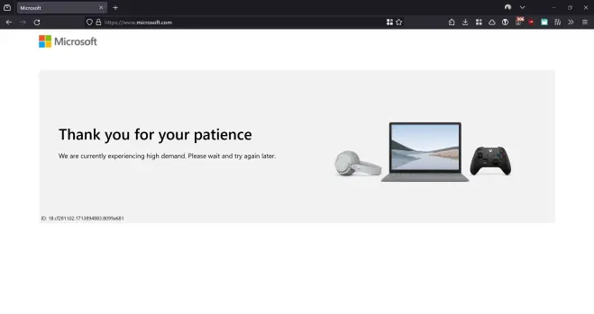 A screenshot of the Microsoft website displaying a message that reads "Thank you for your patience. We are currently experiencing high demand. Please wait and try again later." The message is accompanied by icons representing a laptop computer, a gaming controller, and what appears to be a webcam or microphone device.

The webpage has a simple layout with the Microsoft logo at the top and the text message centered on a plain white background. The laptop icon shows a scenic mountain landscape on its screen. This minimalist image conveys a polite service notification about high website traffic and asks users to be patient during periods of increased demand on Microsoft's servers.