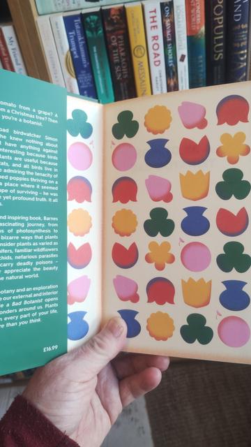 Colourful flower illustrations decoarting the endpapers of a special edition of How to be a Bad Botanist by Simon Barnes