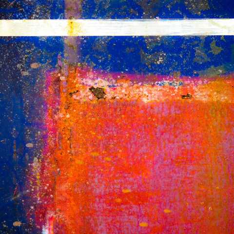 Blue, red and white abstract of the paintwork of a canal boat