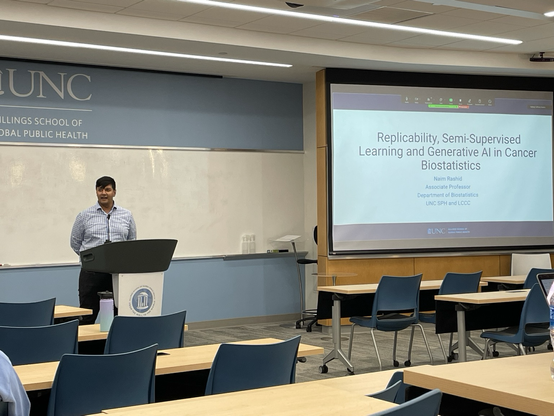Naim Rashid standing at a lecturn at UNC Chapel Hill