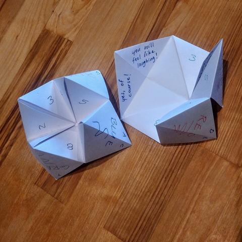 Origami fortune tellers made from printer paper these are fun games and activity partners. You pick a color and then you pick a number and then you pick a second number to reveal a fortune or an activity to perform.