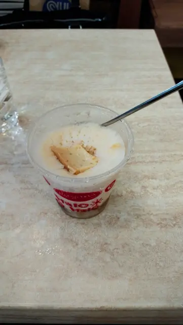 Same cup but from above, showing the leche flan
