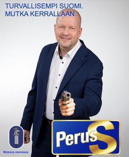 Basic Finn MP Vornanen smiling, a gun is photoshopped in his hand. ”Safer Finland one gun at the time

In cooperation with finnish police forces.”