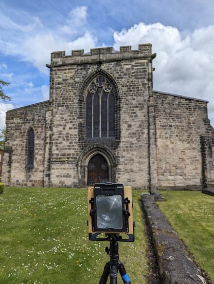 BTS, photo of a 4x5 camera and a church in the background