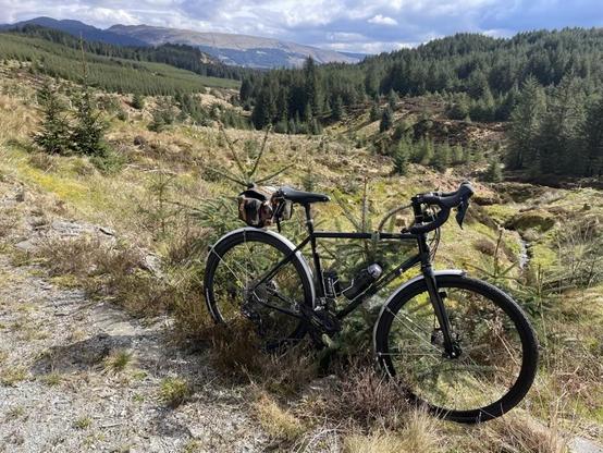 A bicycle against the backdrop of the Trossachs