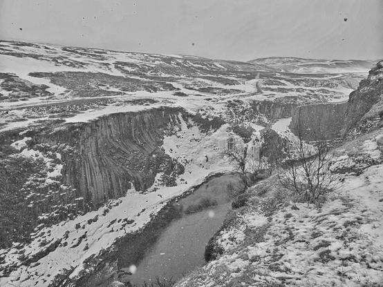 studlagil in Iceland in black & white. basalt columnar covered with snow