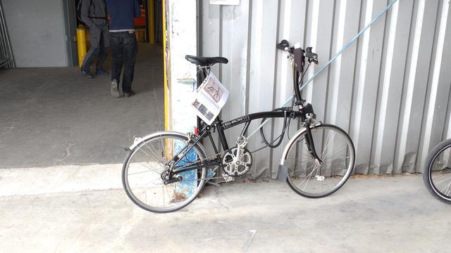 "Big Brompty", a black Brompton with enlarged frame, fork and chainstay to accommodate very narrow 24" road wheels.

Was for sale from private.