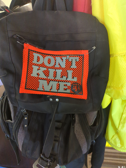 my backpack bib that says don't kill me