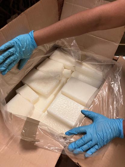 Cubes of sperm whale wax in a box