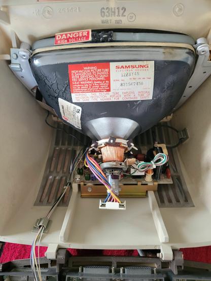 Inside the case of an old computer monitor