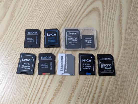 A picture of nine micro SD card adapters.