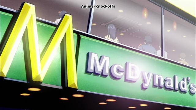 A green signboard with text M McDynald's
