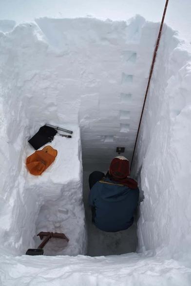 photo - technician measuring snow pack details