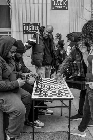 Folks huddled around tables playing chess at Public Square in downtown Cleveland OH
-April 8, 2024