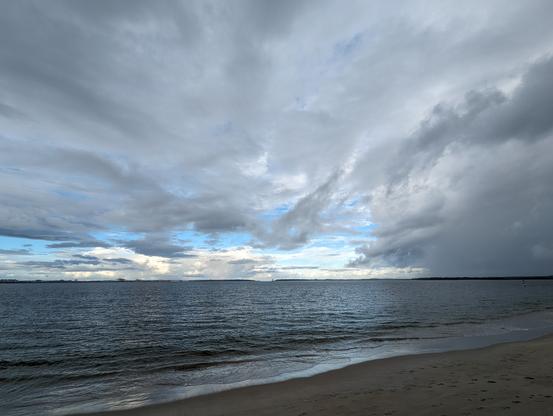 Huge rainy blue sky with clouds above botany bay