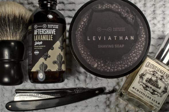 Top view onto a shiny Rolli razor next to a tub of BaM Leviathan, a bottle of BaM Lavanille splash, CL Gratiot League Square frag and a Dogclaration mystery B16