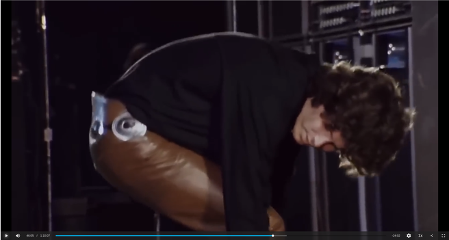 Jim Morrison on stage, bent over with his back to the audience, showing them his ass.