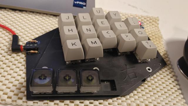 Right half of my keyboard, the thumb keys have Rama Grid keycaps (smokey black) while the alphas have the much higher profile KAT (I think) profile caps
