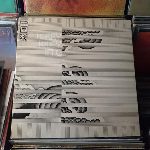 Album cover features lines from a blank musical score. There are no musical annotations; instead, between the lines, there are clouds and spherical shapes, drawn and shaded in pencil.