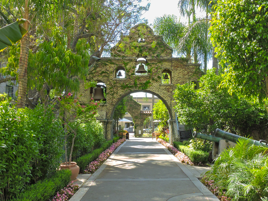 Mission Inn Riverside, California bell arch gardens  here:

https://www.pictorem.com/1965960/Mission%20Inn%20in%20Riverside%20California.html