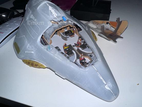 Unpainted model with cockpit canopy removed showing the interior.
