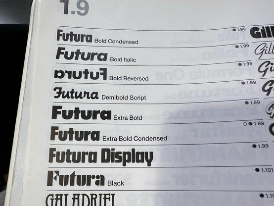 A closeup of a part of the typeface listing in a Letraset catalogue from 1984, focussing on a section listing the different versions of Futura, namely Futura Bold Condensed, Futura Bold Italic, Futura Bold Reversed, Futura Demibold Script, Futura Extra Bold, Futura Extra Bold Condensed, Futura Display and Futura Black. 

They mostly look similar and clearly of the same geometric sans-serif type family, apart from the demibold script version which, as the name suggests, is more of a script style, Futura Display, which is quite blocky, and Futura Black which has a kind of stylised stencil look.