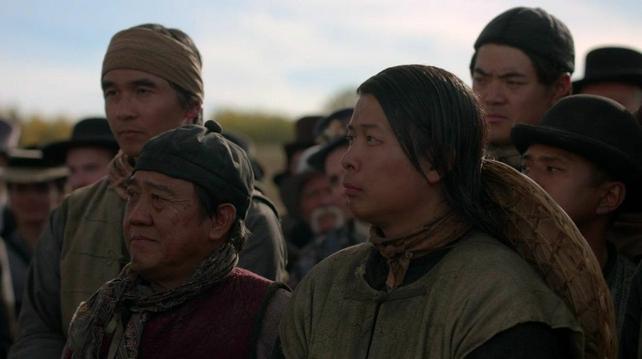 Chinese railroad workers watching a ceremony