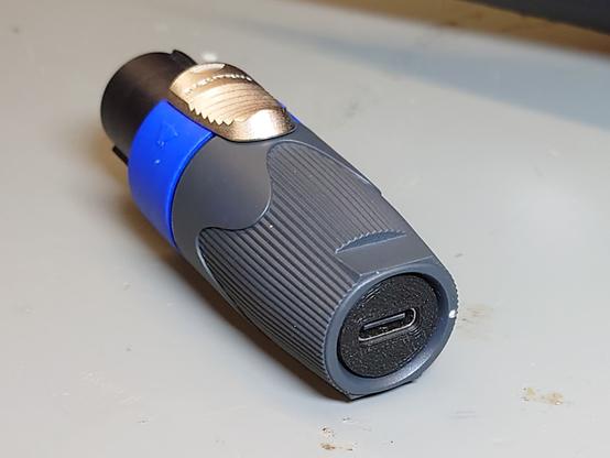The finished USB2Speakon plug.
It's a normal looking NL4 speakON plug, but with a USB-C socket at the rear instead of a cable coming out.