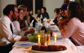 Photo of a family at Shabbos dinner.

I do not know who to credit for the photo