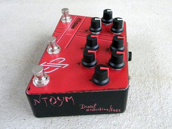 Guitar pedal effect in red enclosure
