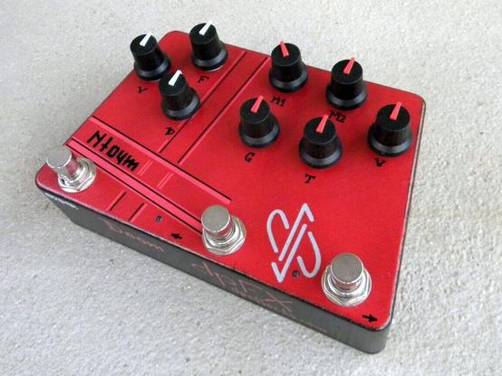 Guitar pedal effect in red enclosure