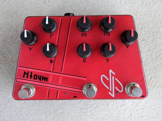 Guitar pedal effect in red enclosure