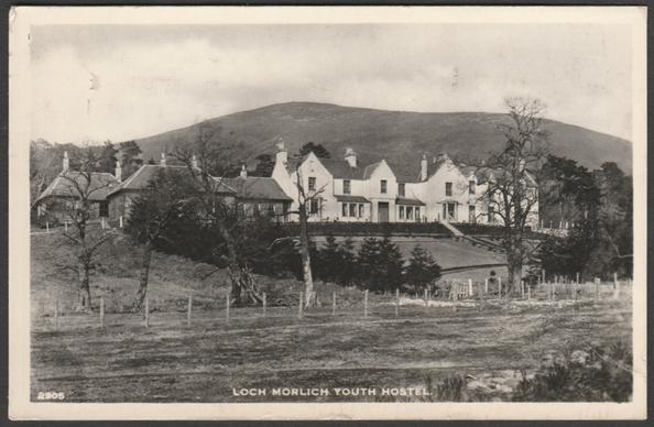 Monochrome real photographic postcard showing a view of Loch Morlich Youth Hostel near Aviemore in Inverness-shire in Scotland.
Published by J.B. White Ltd, Dundee, No 2905.
Postally used on 7 April 1967 with Aviemore postmark on maroon 3d stamp and sent to Brigg, Lincolnshire.
Good condition, with slight corner bumps, but a noticeable amount of cracking to the emulsion, though not unduly affecting the image.