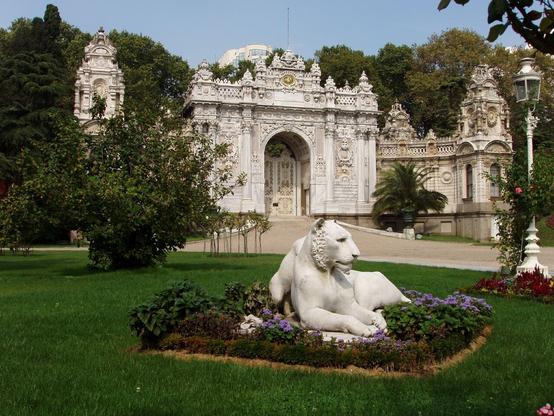highly ornate monumental gate, opening into the landscaped gardens and approach to the sultan's palace.