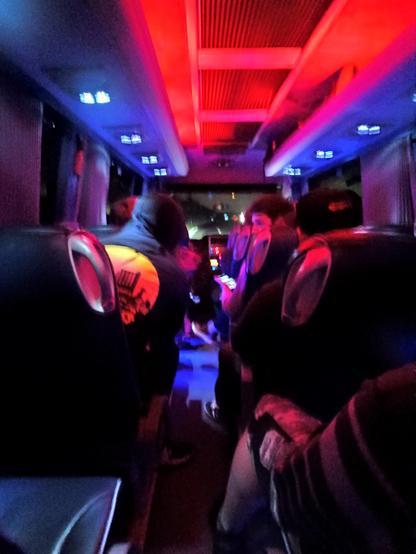 Photo from the back seat of a large minibus during nighttime on the Irish M1.