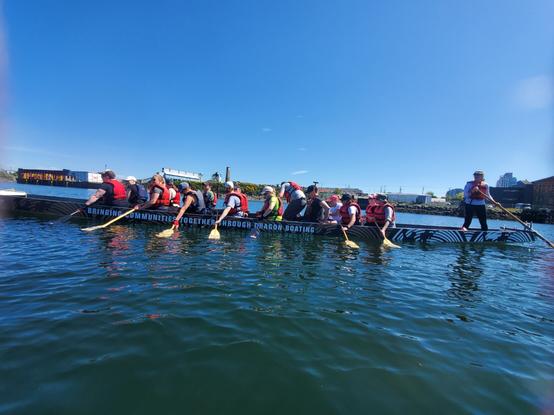 Holding boat steady with paddles in waters