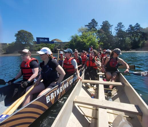 Holding steady with two dragonboats, prepping for race practice starts