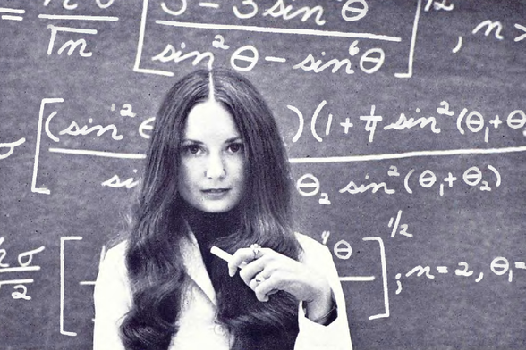1973 Mathematical Muse in the Classroom

In this image, a person is standing in front of a chalkboard filled with mathematical equations.
They are wearing a white lab coat and have long hair.
The individual appears to be gesturing towards something off-camera, as if explaining or pointing out an important concept.
The overall scene suggests an educational or scientific setting, possibly a university or research institution.