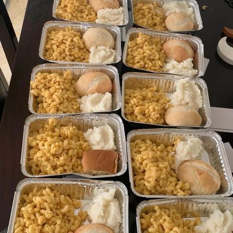 Mac and cheese with potatoes and a roll individually portioned for distro.