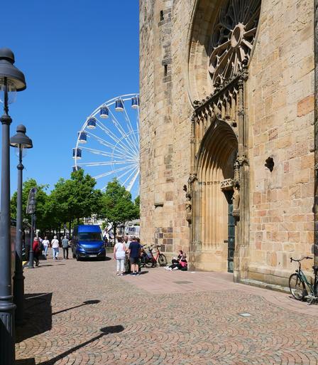 Cathedral towers and ferris wheel