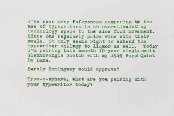 Typewritten index card in green elite type repeating the words of the paragraphs above.
