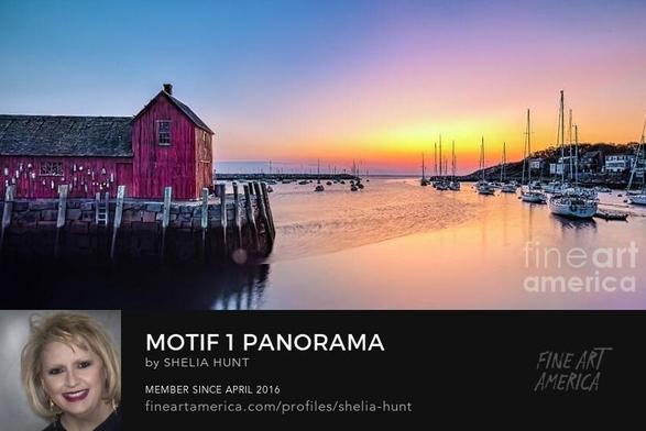 Beautiful panoramic view of Motif #1 at sunrise in the coastal town of Rockport, Massachusetts. Photograph has sunrise hues of orange, yellow and pink, along with the blue sky of early morning.   From the Fine Art Gallery of Shelia Hunt.