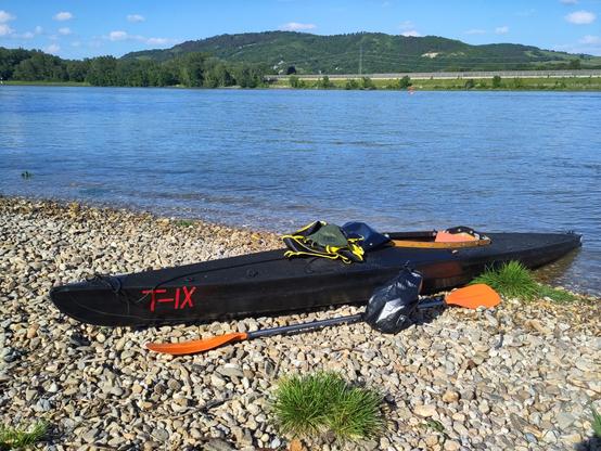 a klepper folding kayak in front of a river
